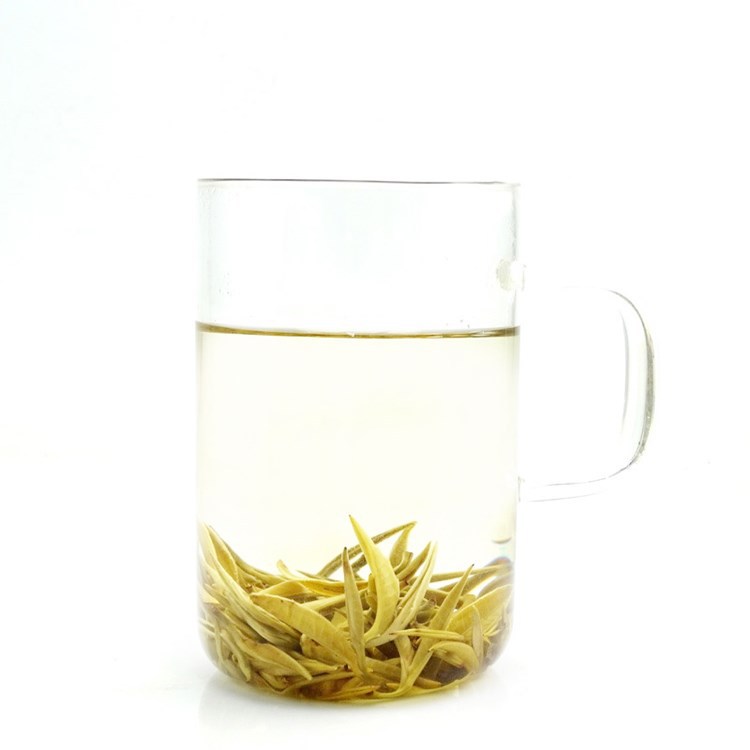 Jasmine green tea leaves opening in a clear glass infusion